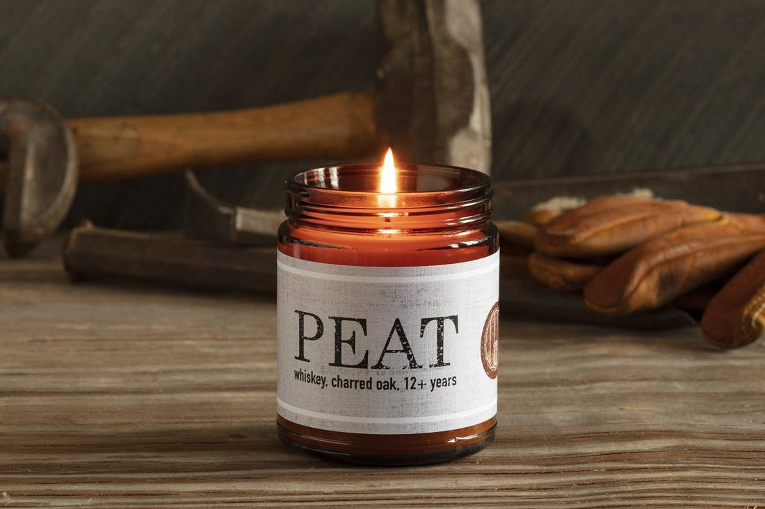 Guy Territory Candle smoke scented with peat and whiskey. Fun ethical gift for fathers, husbands, friends, and partners that gives back.